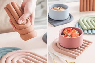 A hand arranging silicone trivets and coasters in various shapes. A bowl with strawberries is placed on one of the trivets